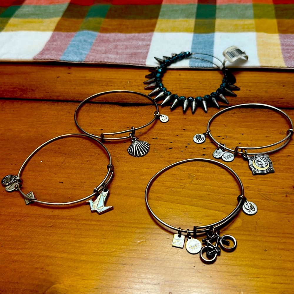 5 Alex and Ani bracelets.